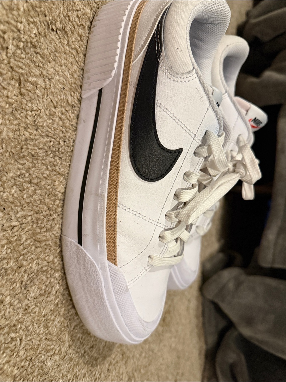 Nike Women’s White Sneakers with Black Swoosh and Tan Accent